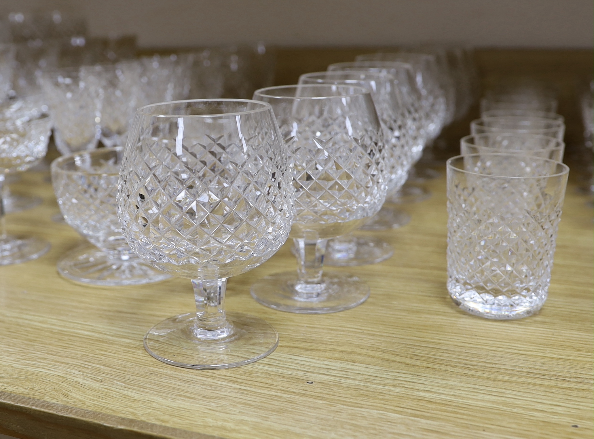 A part suite of Waterford drinking glassware, including champagne glasses, brandy glasses, liquor glasses, wine glasses, etc (61)